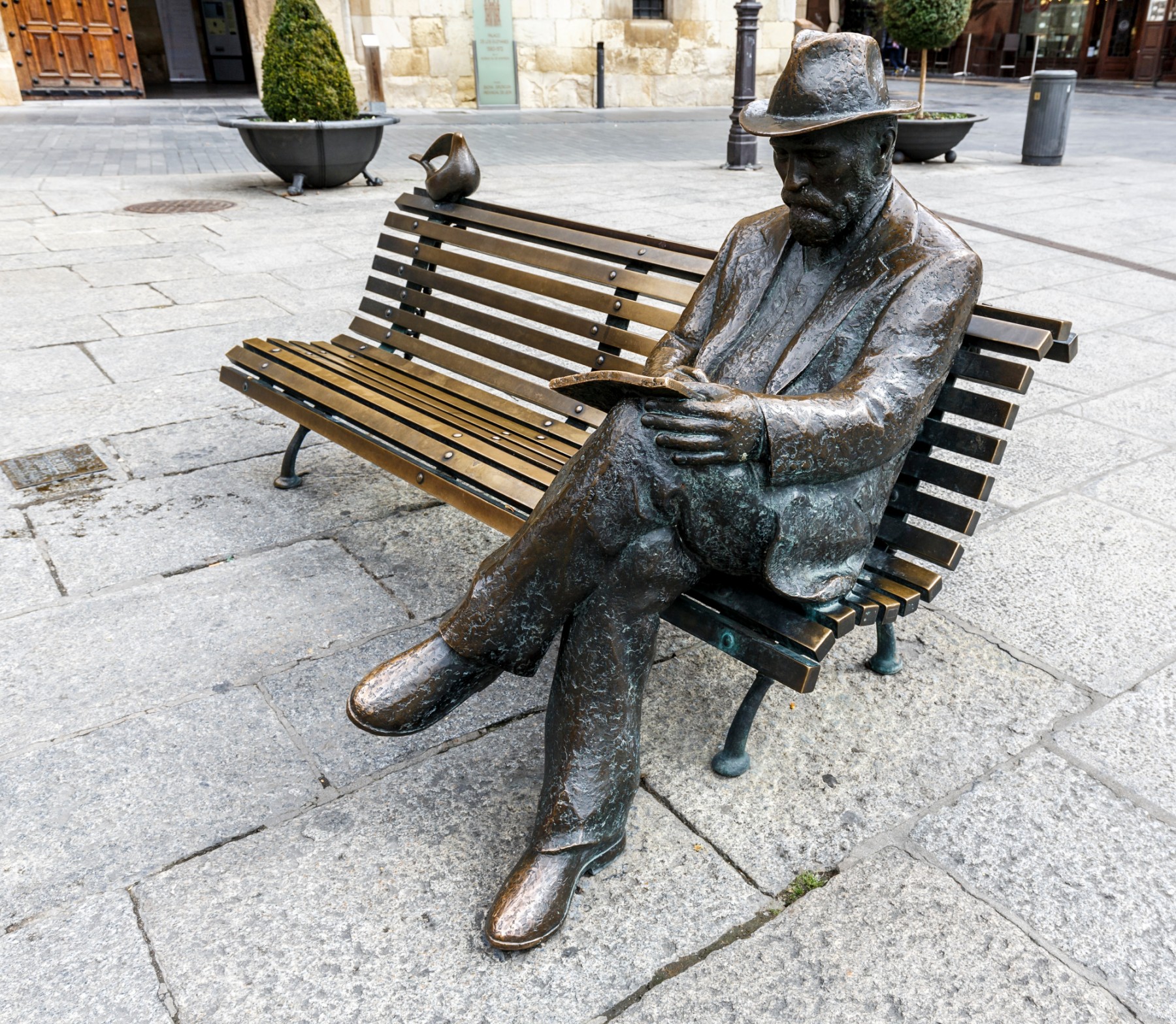 LEON, SPAIN - MAR 23, 2015: Bronze statue of Antonio Gaudi in Leon by José Luis Fernández, his work Against House Treads, is the only building designed and built by Gaudí in the city of León.